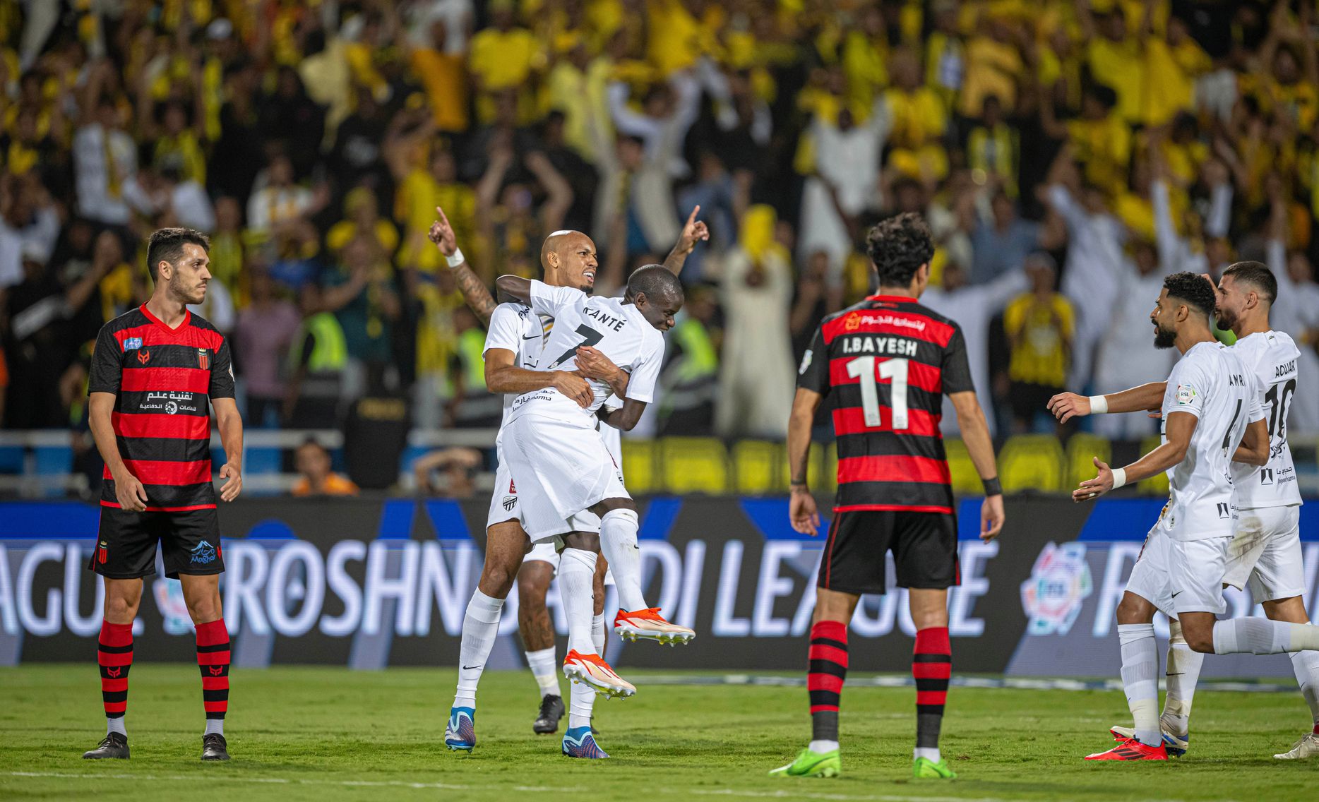 N'Golo Kante is congratulated by Al Ittihad teammates for goal v Al Riyadh