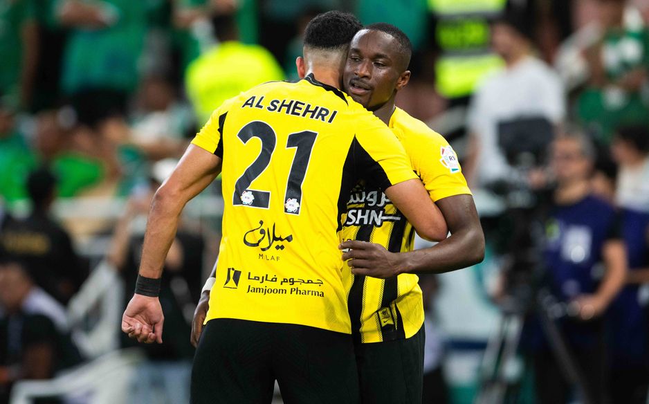 Moussa Diaby and Saleh Al Shehri embrace after the former's assist