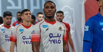 Odion Ighalo (C) in the pre-match line-up for Al Wehda