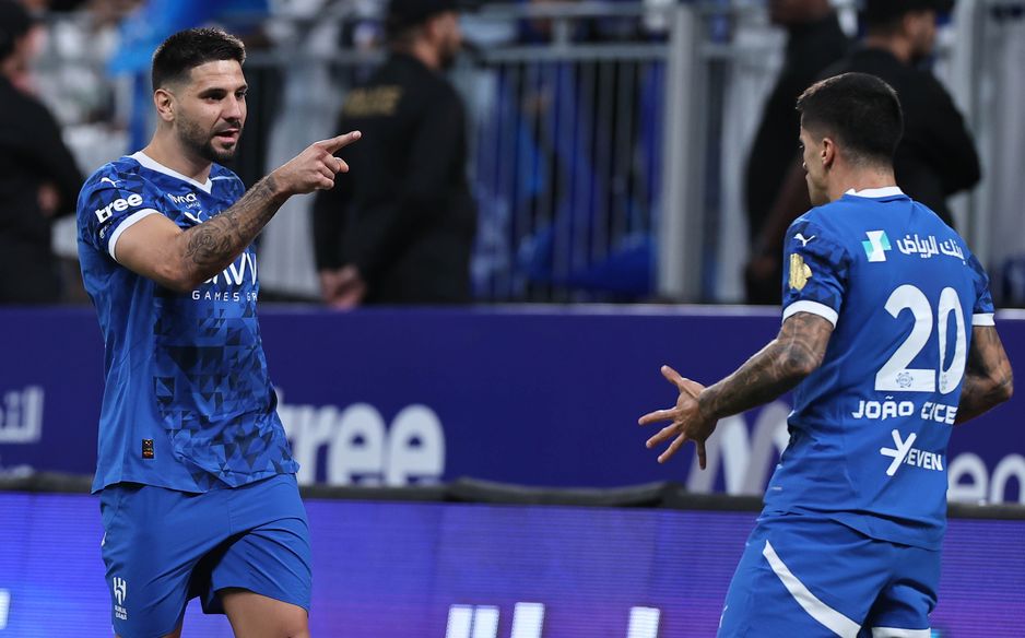 Al Hilal's Aleksandar Mitrovic (L) and Joao Cancelo