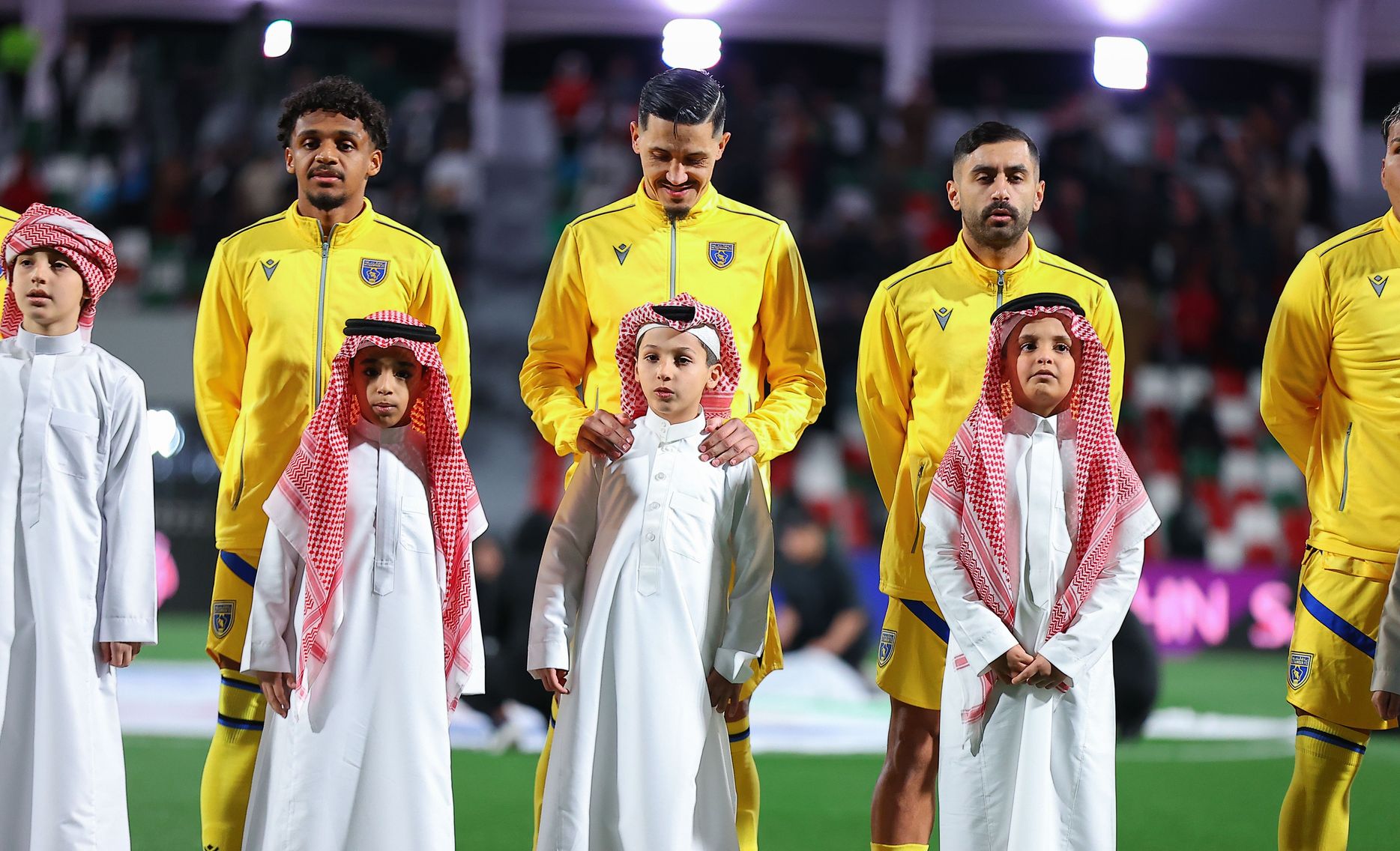 Al Taawoun line up before match at Al Ettifaq