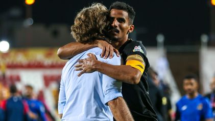 Al Wehda captain Waleed Bakshween embraces manager Jose Daniel Carreno after win at Damac