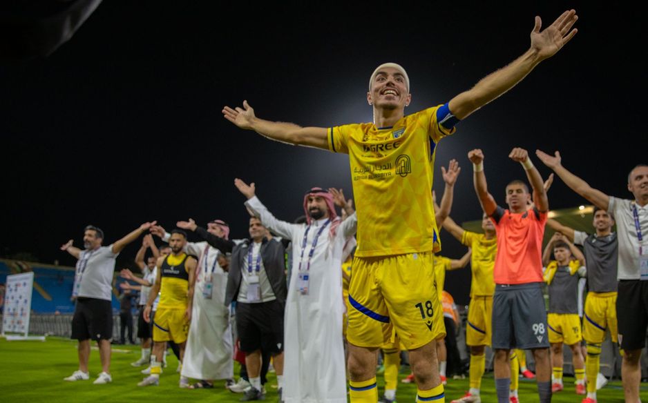 Al Taawoun captain Aschraf El Mahdioui leads the celebrations after Qassim Derby win v Al Raed
