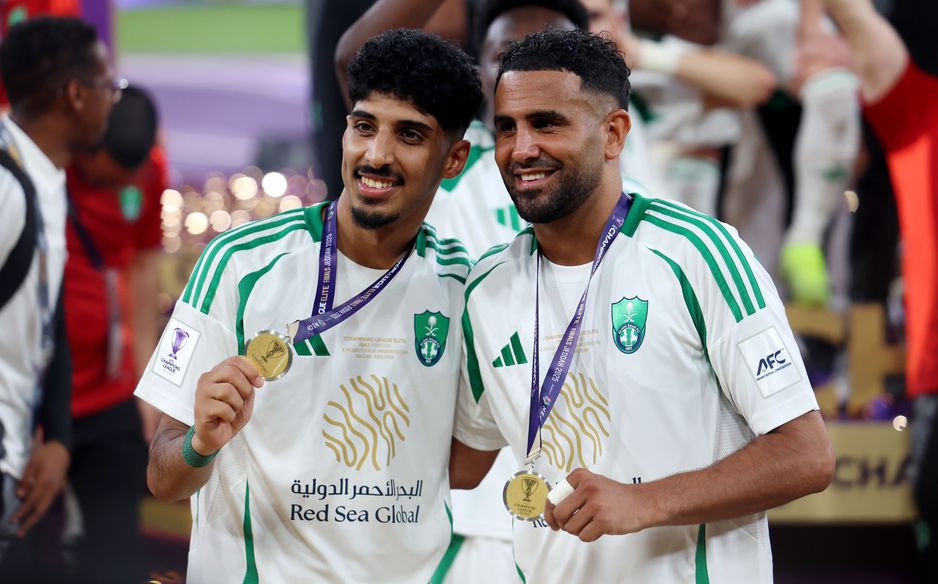 Ziyad Al Johani (L) and Riyad Mahrez celebrate Al Ahli winning AFC Champions League Elite