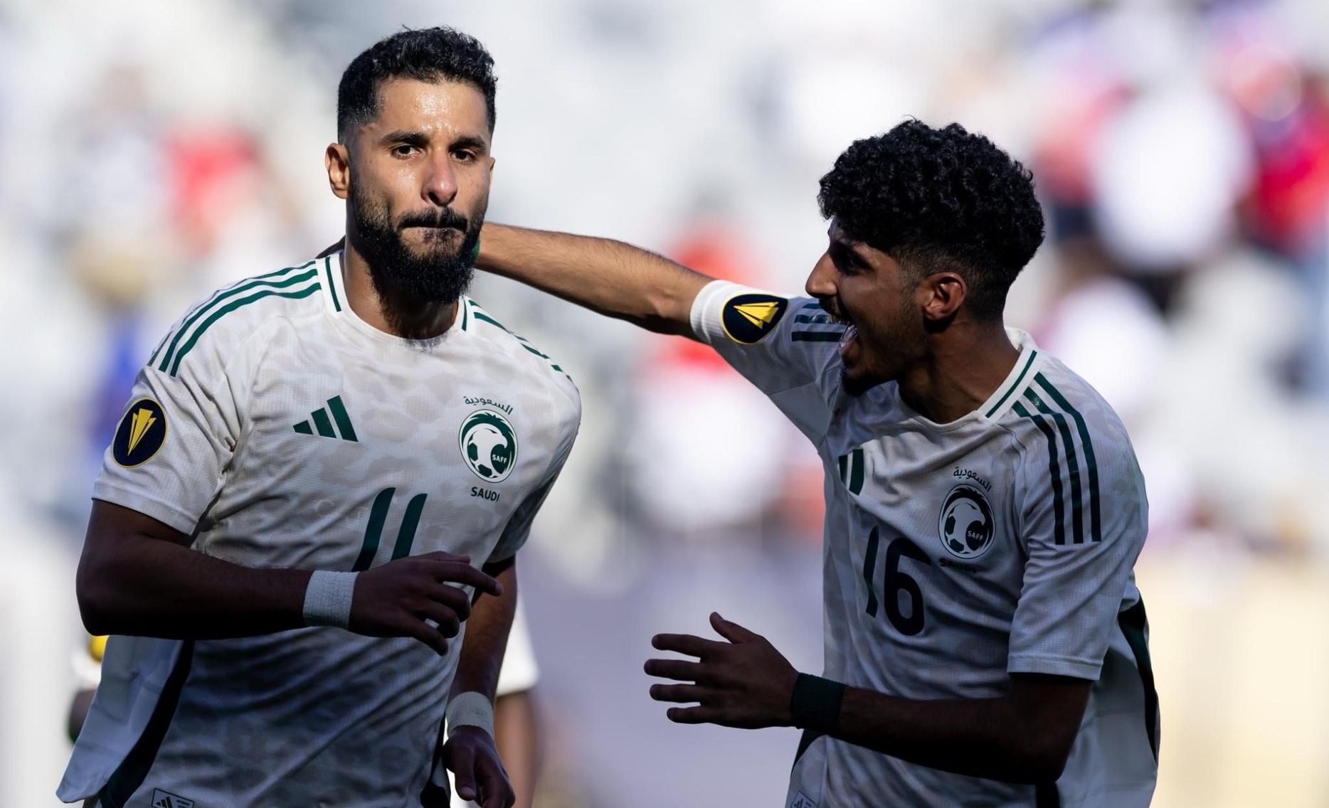 Saudi Arabia's Saleh Al Shehri (L) celebrates winner v Haiti in CONCACAF Gold Cup with Ziyad Al Johani