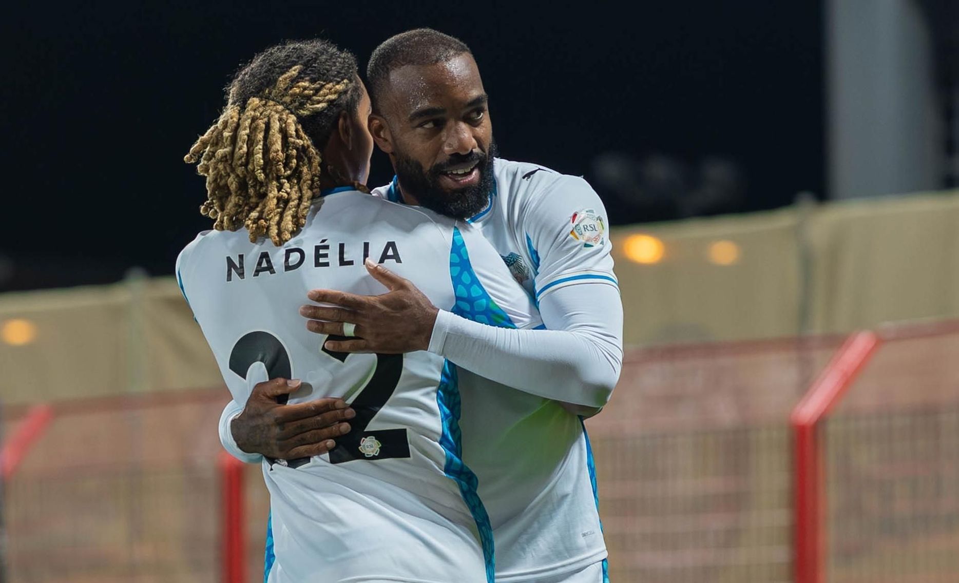 NEOM SC's Saimon Bouabre and Alexandre Lacazette celebrate goal at Damac