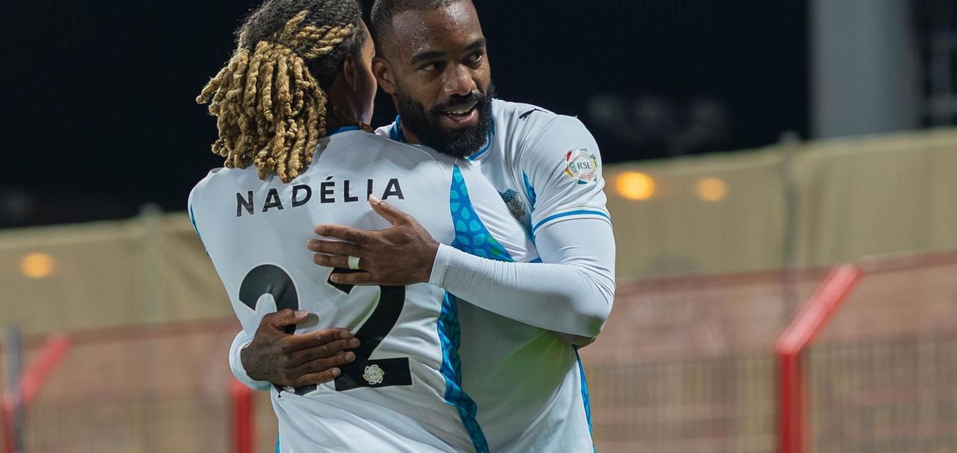 NEOM SC's Saimon Bouabre and Alexandre Lacazette celebrate goal at Damac