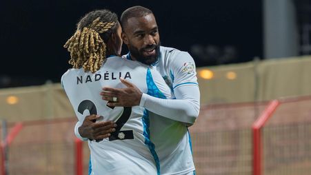 NEOM SC's Saimon Bouabre and Alexandre Lacazette celebrate goal at Damac