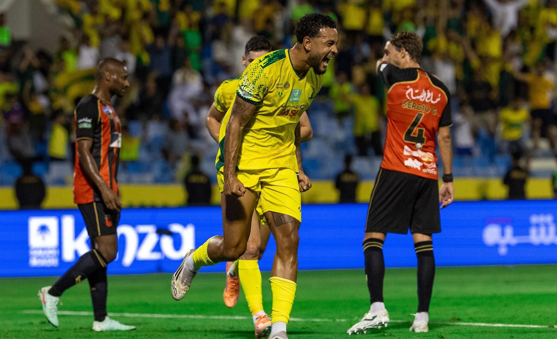 Joshua King celebrates one of his three goals for Al Khaleej v Al Riyadh