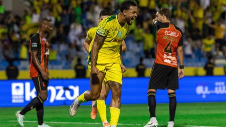 Joshua King celebrates one of his three goals for Al Khaleej v Al Riyadh