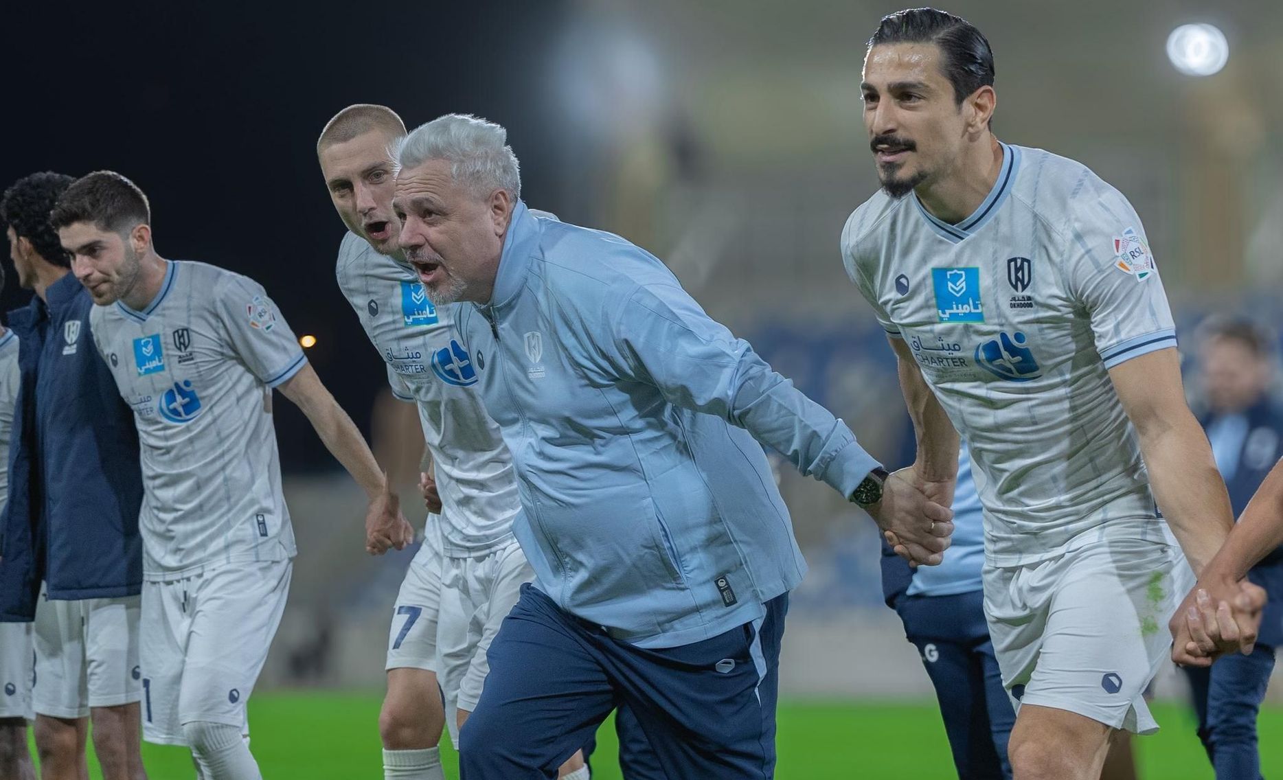 Al Okhdood celebrate home win v Al Kholood