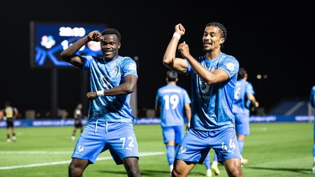 NEOM SC's Amadou Kone (L) and Nathan Zeze celebrate goal in win v Damac 