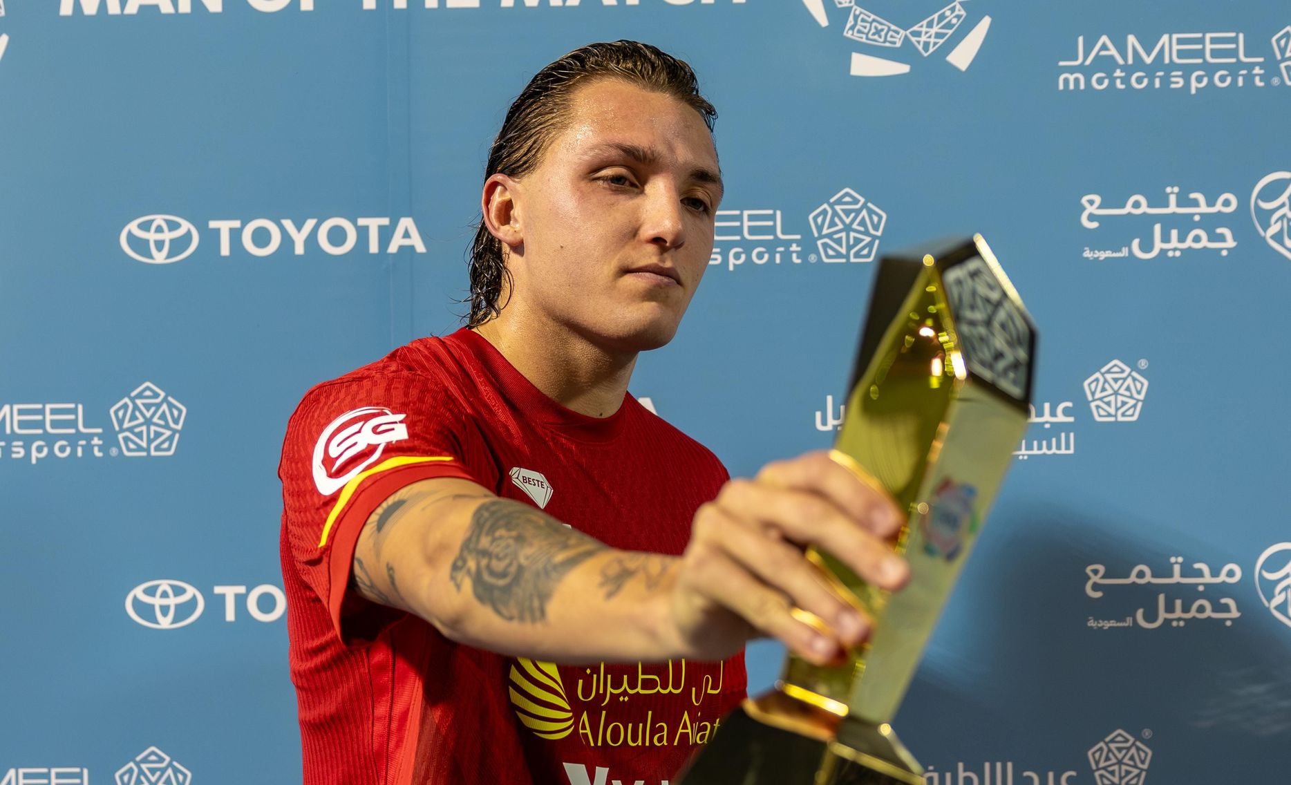 Al Qadsiah's Mateo Retegui picks up his Man of the Match award v Al Khaleej