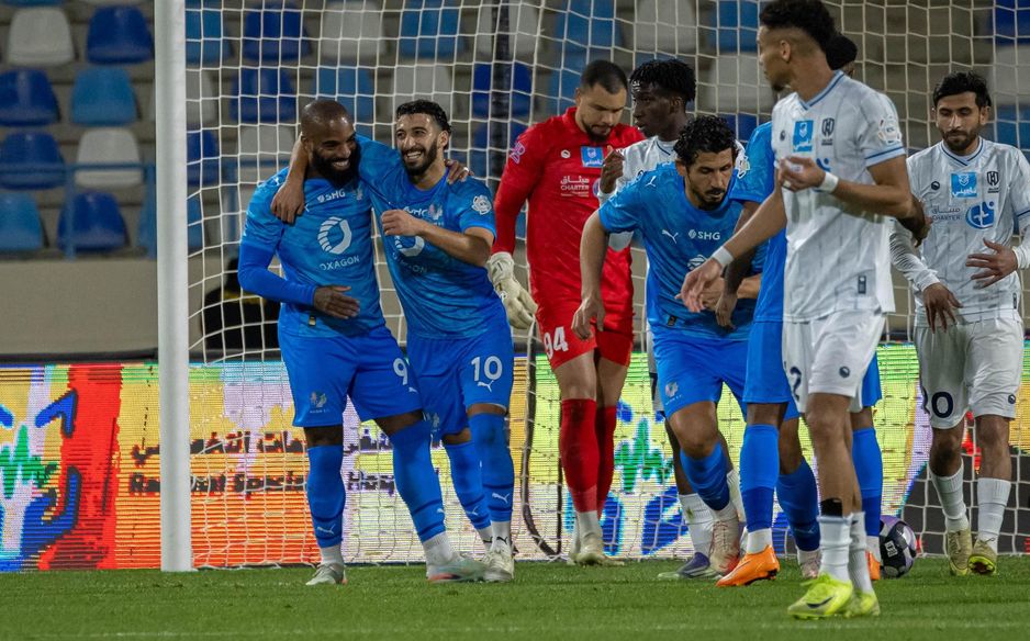 NEOM SC's Alexandre Lacazette (L) salvaged a point late on at Al Okhdood