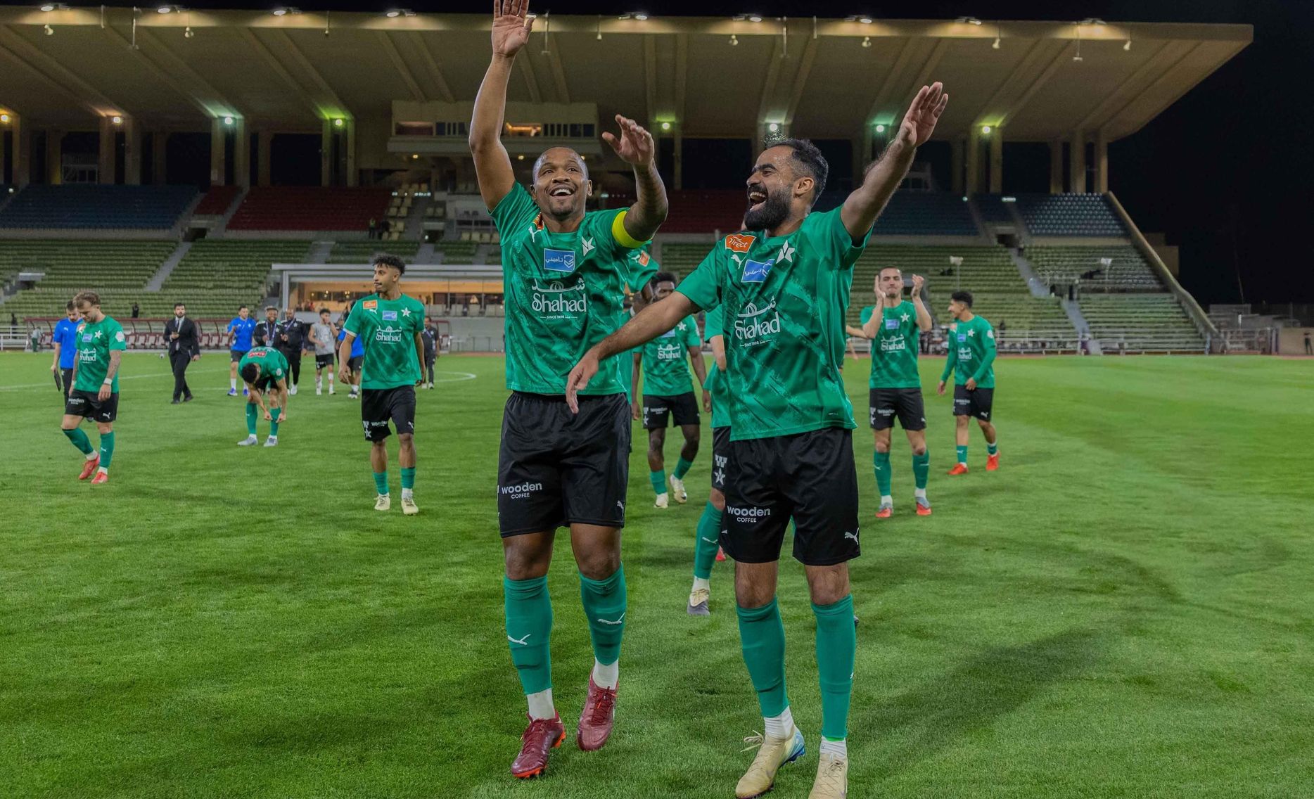 Al Najmah captain Samir (L) leads celebrations after historic win v Al Kholood 