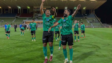 Al Najmah captain Samir (L) leads celebrations after historic win v Al Kholood 