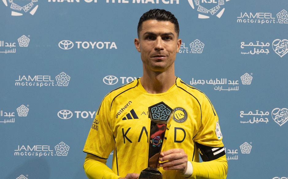 Cristiano Ronaldo collects Man of the Match award for display v Al Hazem