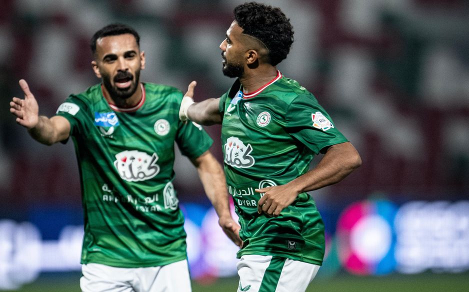 Al Ettifaq defender Madallah Al Olayan (L) celebrates Khalid Al Ghannam's goal v Al Fateh