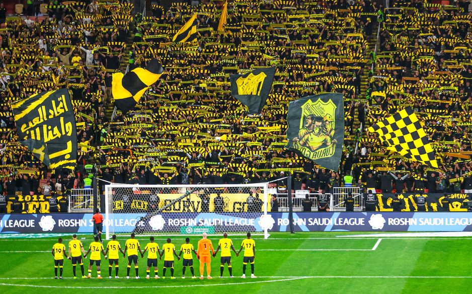 Al Ittihad players line up before their legion of fans - a pre-match tradition