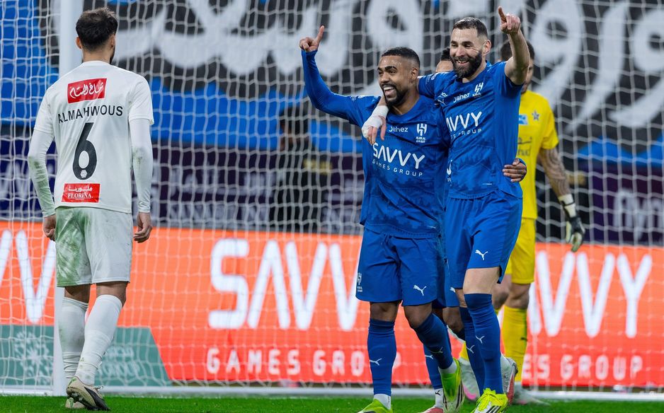 Karim Benzema (R) celebrates Malcom getting Al Hilal's third of the night v Al Najmah