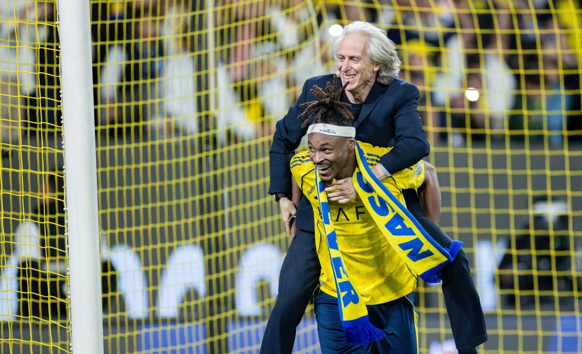 Mohamed Simakan celebrates Al Nassr win v NEOM SC with Jorge Jesus