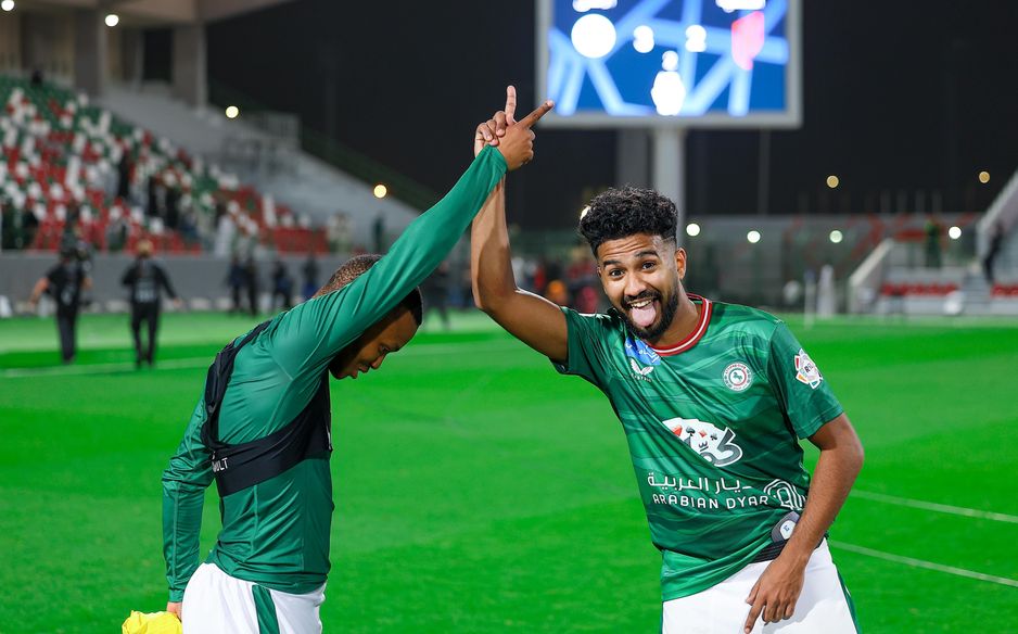 Al Ettifaq duo Mohau Nkota (L) and Khalid Al Ghannam celebrate Eastern Derby win v Al Qadsiah