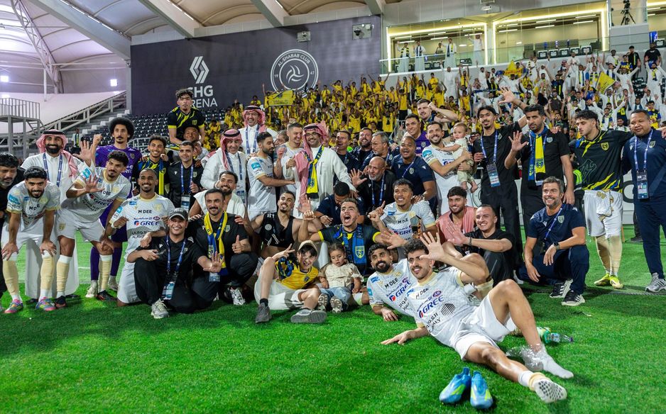 Al Taawoun celebrate their thumping 5-1 win at Al Shabab