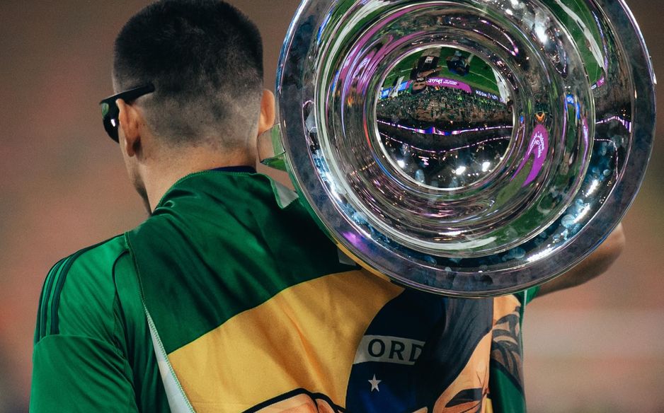 Draped in Brazil colours, Roger Ibanez with the ACL Elite trophy