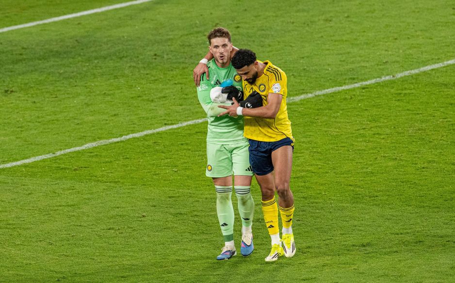 Al Nassr defender Abdulelah Al Amri consoles Bento following his error in Capital Derby v Al Hilal