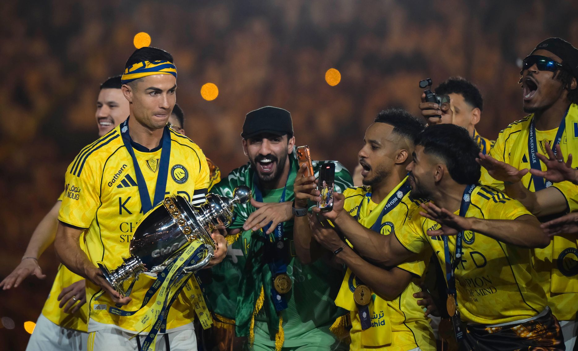 Cristiano Ronaldo carries the long-awaited RSL trophy to his Al Nassr teammates
