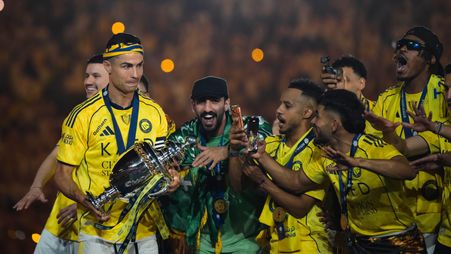 Cristiano Ronaldo carries the long-awaited RSL trophy to his Al Nassr teammates