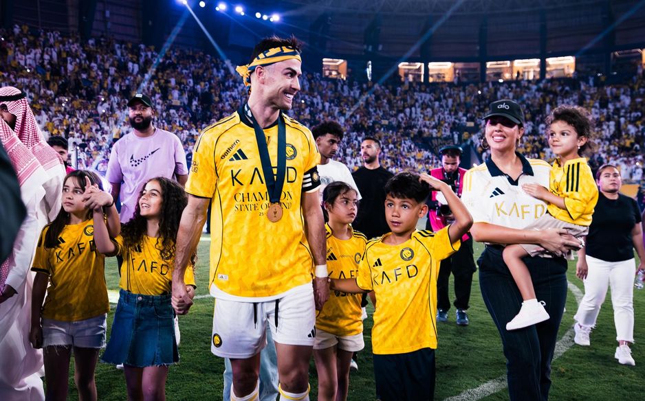 Cristiano Ronaldo is joined by his family on the pitch for Al Nassr's title celebrations