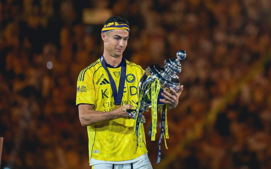Cristiano Ronaldo takes in the moment he finally gets hands on RSL trophy