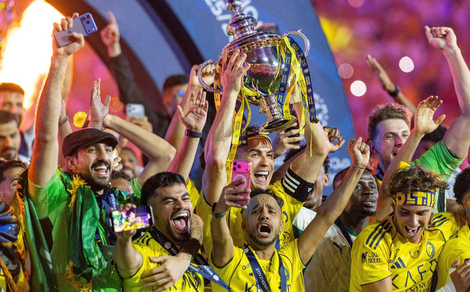 Cristiano Ronaldo lifts the RSL trophy with his ecstatic Al Nassr teammates