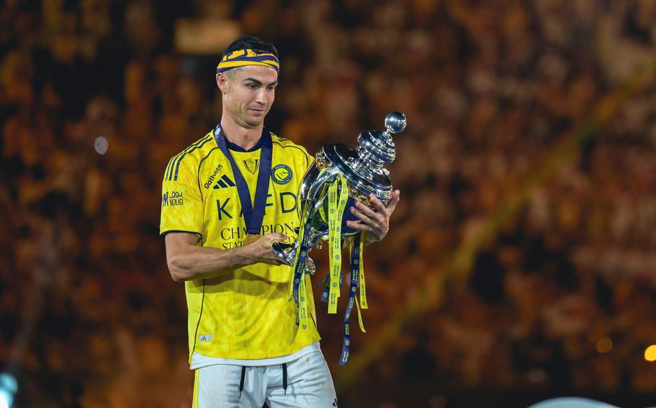 Cristiano Ronaldo takes in the moment he finally gets hands on RSL trophy